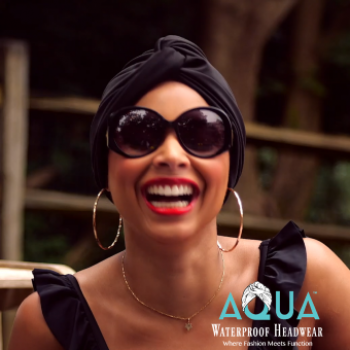 Woman Smiling Wearing A Black AQUA Waterproof Vintage Twist Turban V